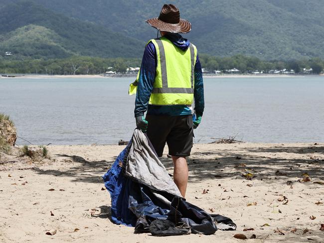 Businessman Audrius Macernis has purchased Taylor Point, the northmost parcel of land at Trinity Beach, for an undisclosed sum. The environmentalist plans to work with other conservation groups through his own organisation, the Macernis Group, to restore the landscape and bring Taylor Point back to its natural state. Taylor Point owner Audrius Macernis dismantles a tent that was set up on the headland by squatters. Picture: Brendan Radke