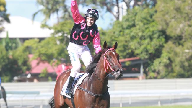 Stathi Katsidis salutes after winning the 2010 Magic Millions on Military Rose. Picture: Jono Searle