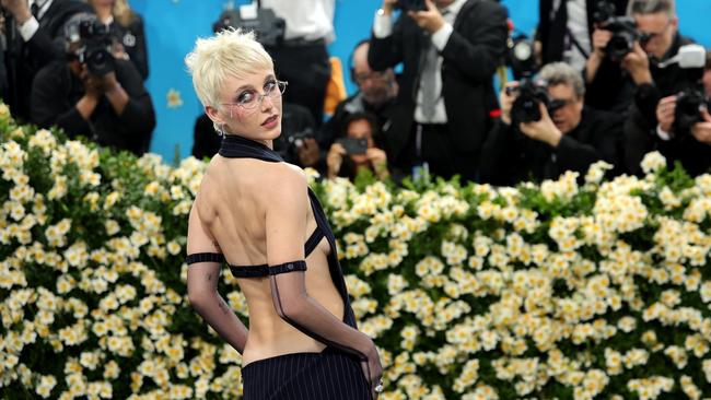 23-year-old Emma Chamberlain once again served as Vogue’s red carpet correspondent, wearing a pinstripe Courreges dress by Nicolas Di Felice. Picture: Getty