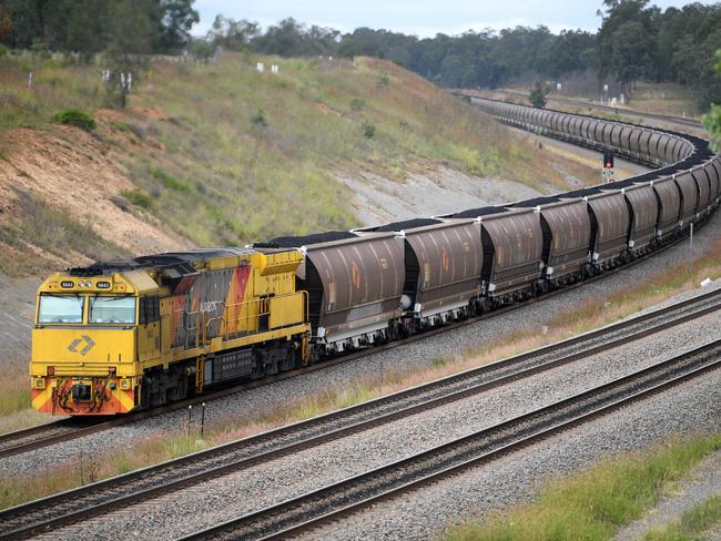 A loaded coal train is seen passing through the outskirts of Singleton, in the NSW Hunter Valley region, on Sunday, April 22, 2018. (AAP Image/Dan Himbrechts) NO ARCHIVING