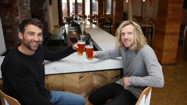 Co-owners Corey Enright and Mat Dyer enjoy a beer after purchasing the Geelong Hotel in 2018. Picture: Alison Wynd