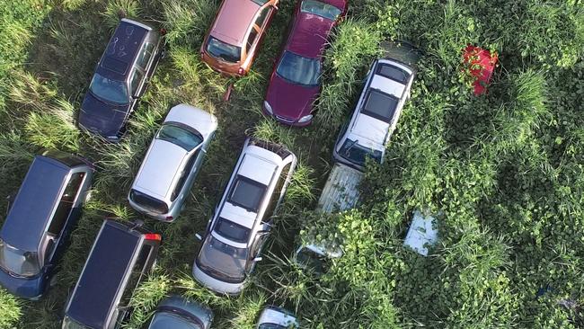 *ONE TIME WEB USE FOR NEWS.COM.AU* EXCLUSIVE. SPECIAL FEES APPLY . MANDATORY CREDIT: Arkadiusz Podniesinski/REX Shutterstock Mandatory Credit: Photo by Arkadiusz Podniesinski/REX Shutterstock (5224634a) An aerial photograph of abandoned vehicles. They can?t be removed until the owners give their consent. In the background the hills to which the schoolchildren escaped. Fukushima, Japan - Sep 2015 FULL COPY: http://www.rexfeatures.com/nanolink/r7ku MINIMUM USE FEE A photographer has taken stunning and revealing pictures of the exclusion zone from the 2011 Fukushima Nuclear Disaster. Within a 20km radius the radioactive exclusion zone demonstrates the dangerous nature of nuclear energy. A network of abandoned towns and villages that once housed hundreds of thousands of people, the exclusion zone of the largest nuclear accident since Chernobyl is eerie and frightening.