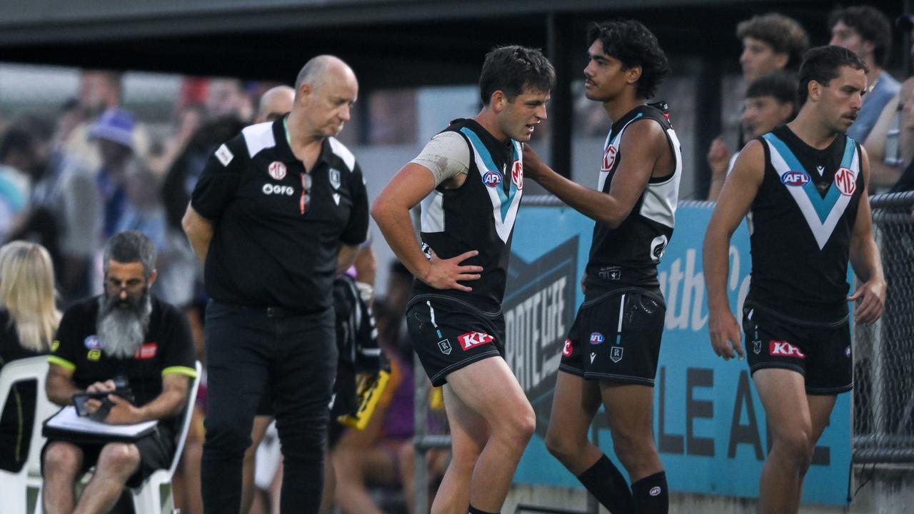 Zak Butters leaves the ground after hurting his ankle against the Dockers at Alberton Oval. Picture: Mark Brake/Getty Images.