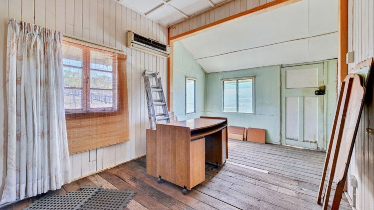 The home is finished with its original five-inch wooden floorboards.