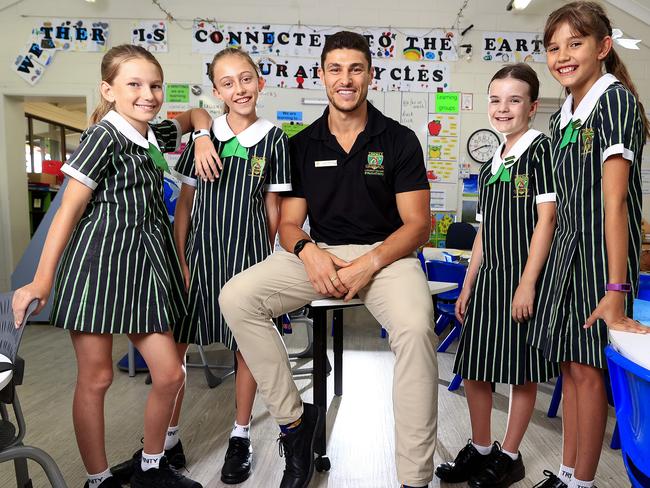 Qweekend - teacher of the year awards. Corey Micari from Trinity Lutheran College, Ashmore has been nominated. He's a Year 5 teacher and ex footballer. With students Mackenzie Kennedy 10, Kayla Hansmeyer 10, Jessica Auckland 10, Peyton McFarlane 10. Pics Adam Head