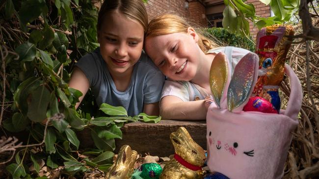 Sisters Jess and Pippa Edwards finds a stash of Easter eggs in their garden at Barwon Heads. Picture: Brad Fleet