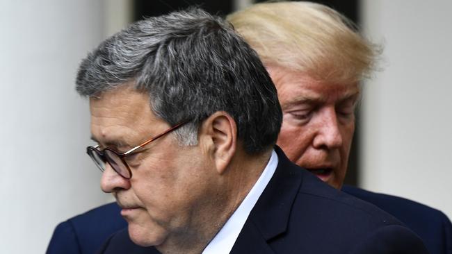 US Attorney-General William Barr with Donald Trump at the White House. Picture: AFP