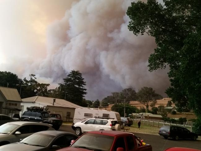 Bushfire approaches Buchan, in East Gippsland, late in December last year (2019). On December 30, the fire burnt many houses in the town, which eventually lost 24 homes and where one man died. Picture: Supplied.