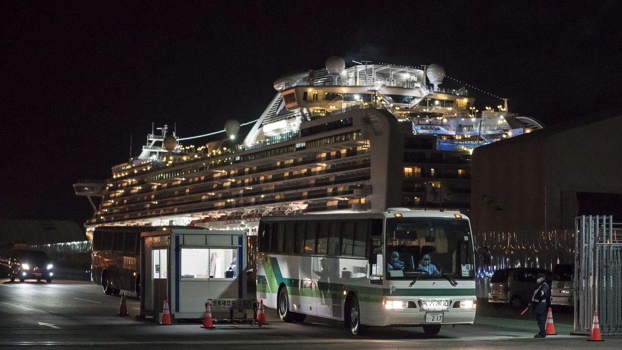 A bus carrying passengers out of the quarantined Diamond Princess cruise ship. Picture: Tomohiro Ohsumi/Getty Images