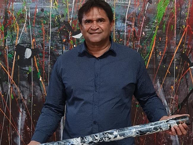 Nicky Winmar with some of his artwork which is being exhibited at the Mitchelton Gallery of Aboriginal Art , Picture:  Adam Knight