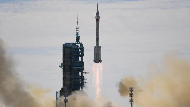 A Long March-2F carrier rocket, carrying the Shenzhou-12 spacecraft and crew lifts off from the Jiuquan Satellite Launch Centre in the Gobi desert in northwest China on June 17, 2021. Picture: AFP