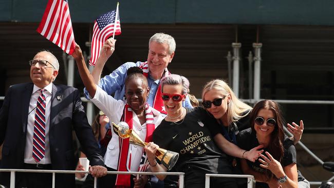 Megan Rapinoe (red glasses) has led a chorus calling for equal World Cup prizemoney. Picture: Getty