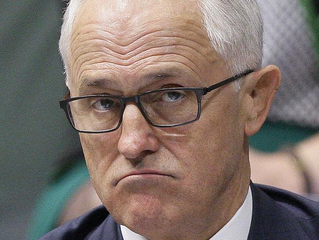 Australian Prime Minister Malcolm Turnbull sits in parliament in Canberra, Tuesday, March 27, 2018. Australia's former Prime Minister Tony Abbott hinted that he still held leadership ambitions as his replacement struggles to turn around the government's disastrous opinion polling. (AP Photo/Rod McGuirk)