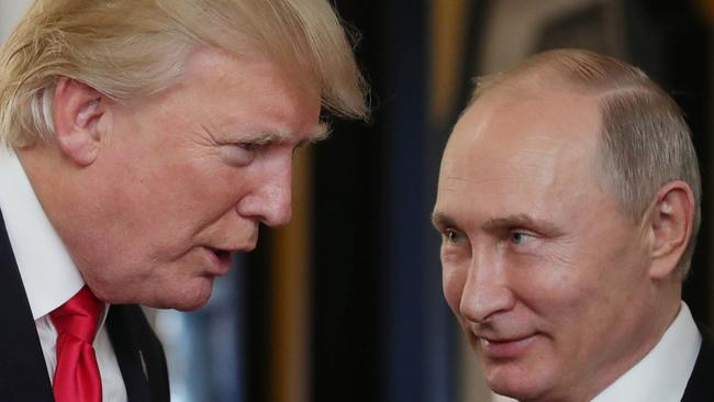 US President Donald Trump and Russia's President Vladimir Putin at the APEC Economic Leaders' Meeting in Vietnam. Picture: AFP