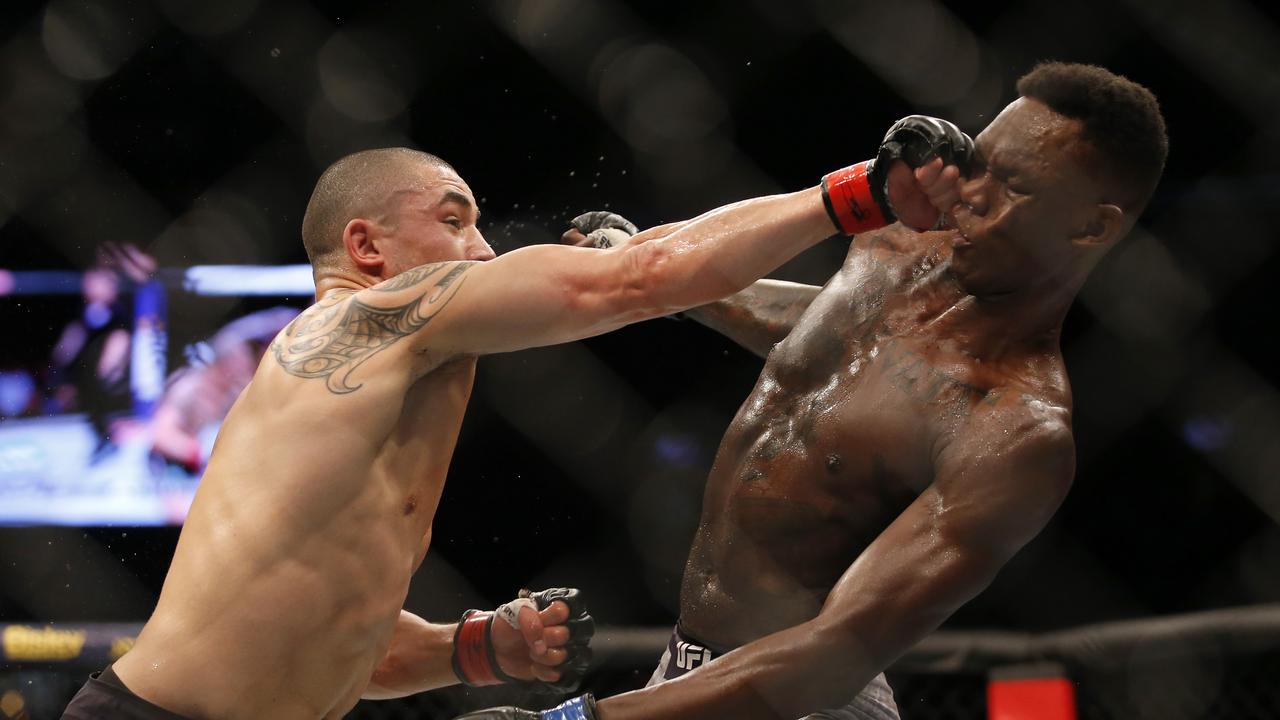 Robert Whittaker and Israel Adesanya. Picture: Darrian Traynor/Getty