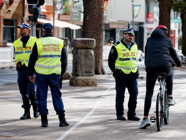 Police stopped bike riders on Manly Beach to let them know the rules around e-bikes and e-scooters. Picture: NCA NewsWire / Nikki Short