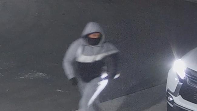 A man can be seen wearing a black, grey and white jumper. Picture: NSW Police