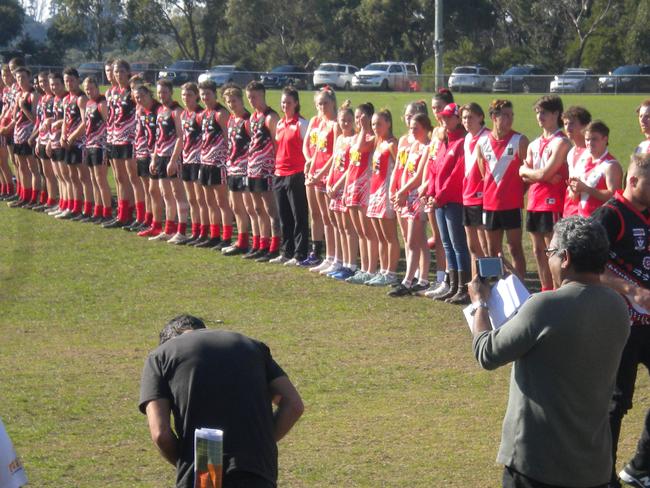 Players line-up at the reconciliation game at Red Hill last Saturday.