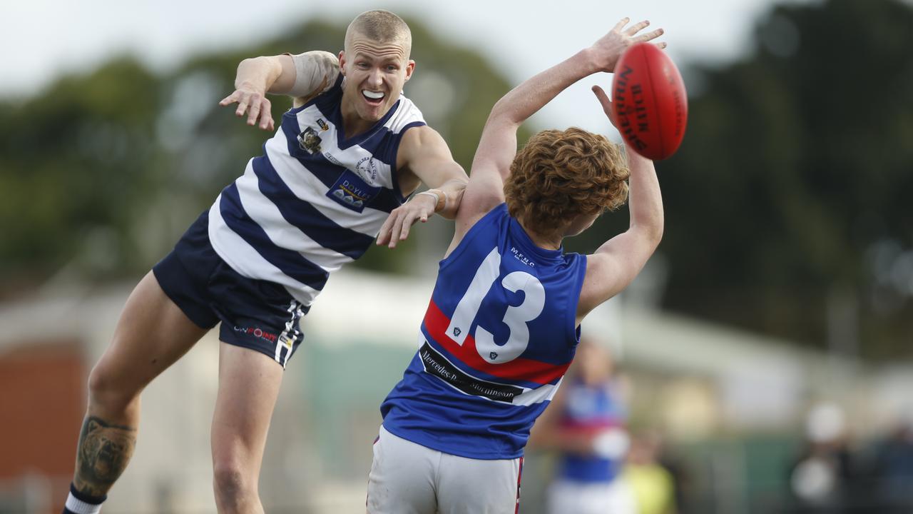 MPNFL: Chelsea’s Jesse Davies tries to spoil Matthew Caine of Mornington. Picture: Valeriu Campan