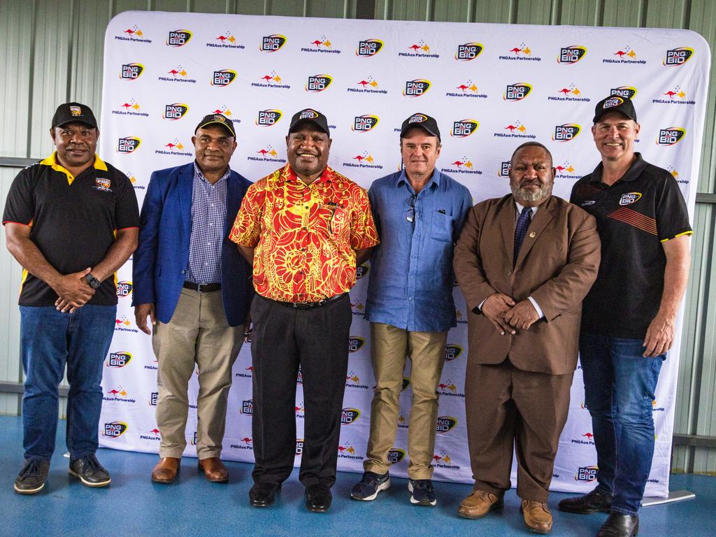 (Left to right) PNG RL CEO Stanley Hondina, PNG NRL bid chairman Wapu Sonk, Prime Minister James Marape, PNG High Commissioner John Feakes, PNG RL chairman Sandis Tsaka and NRL bid CEO Andrew Hill.