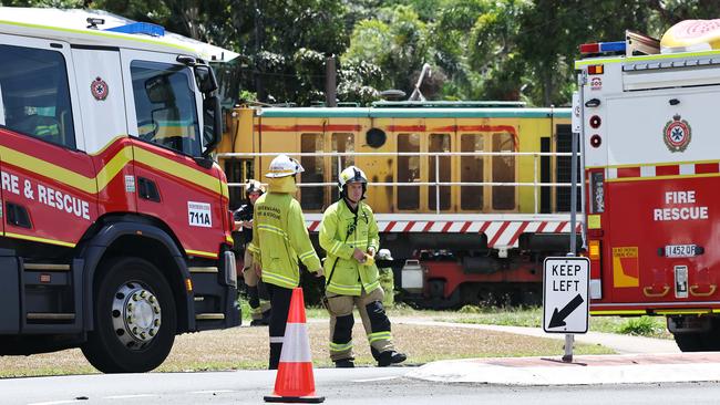 Emergency services personnel respond to a collision between a small car and a cane train at a level crossing on Beatrice Street, Mooroobool last month. Picture: Brendan Radke