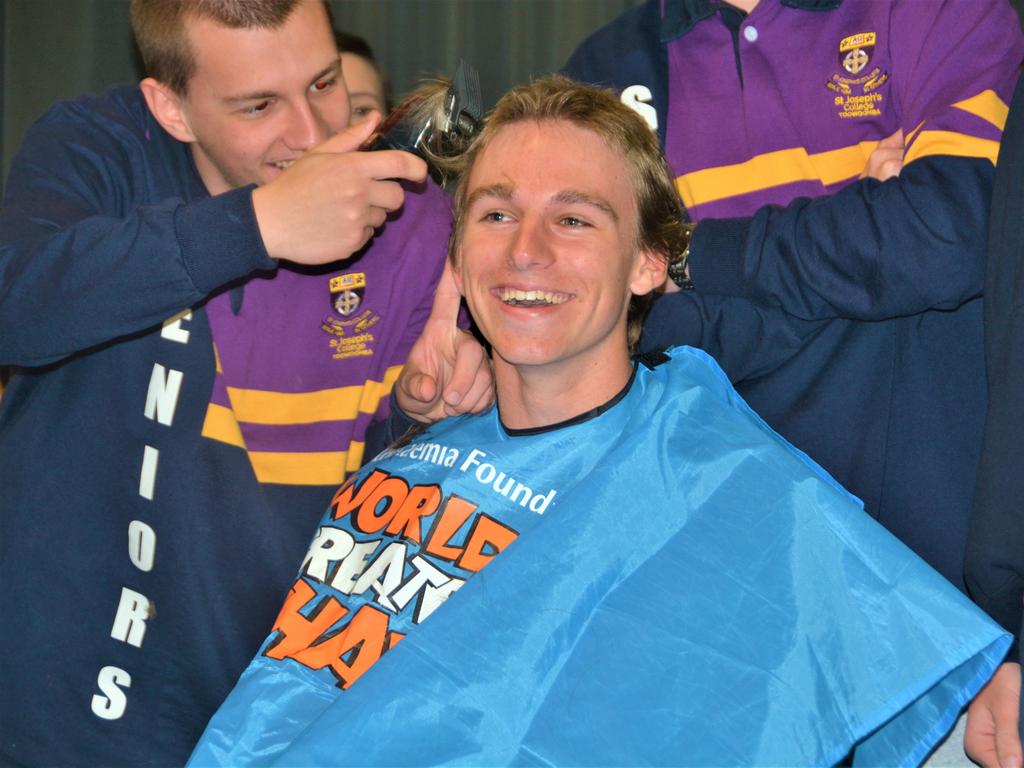 At the St Joseph's College 2023 World's Greatest Shave event is student Charlie Kruger having his hair cut by friends. Picture: Rhylea Millar