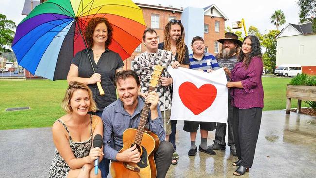 Promoting the free community gathering to mark one year since the 2017 March flood are (front) musicians Kate Stroud from Lady Mondegreen and Luke Vassella with (rear l-r) organiser and Lismore City Councillor Elly Bird and performers from The Overtopping Mike Smith, Tom Kelly, Chris Wilkinson, Zeb Schulz and Sunita Bala. Picture: Terra Sword