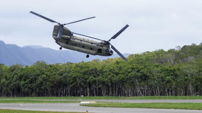 An Australian Army Chinook helicopter takes off from the Cooktown Airport, bound for the Indigenous community of Wujal Wujal last December. Picture: Brendan Radke