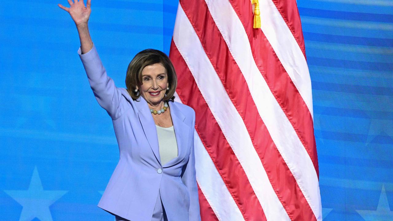 Former US House Speaker Nancy Pelosi waves as she arrives onstage. Picture: AFP.