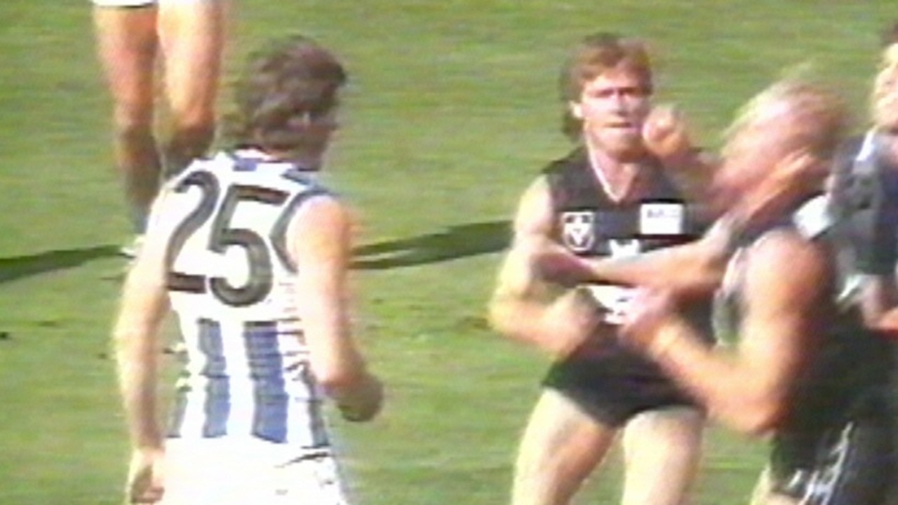 Alastair Clarkson strikes Ian Aitken during the tainted Carlton and North Melbourne contest played in London in 1987.