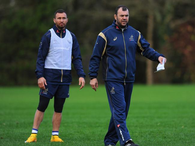 Wallabies coach Michael Cheika (r) and Quade Cooper look on during a training session.