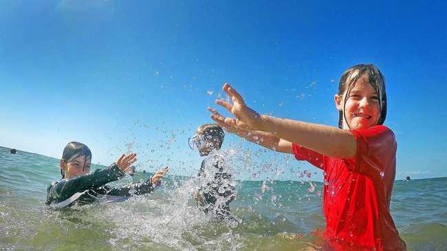 TEMPERATURES SOARING: Declan, 8, Elijah, 10 and Paige Haupstein, 8, cooling off in the waters of Torquay beach as they try to escape the summer heat. Picture: Cody Fox