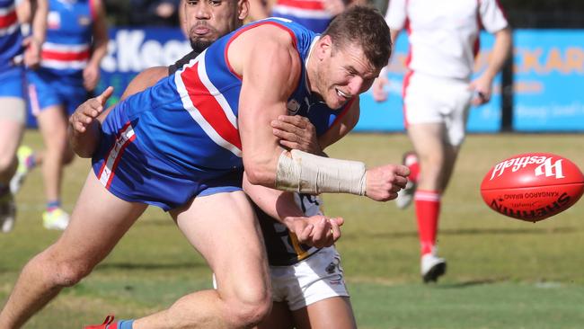 Walker feeds a handball out for South Croydon. Picture: David Crosling