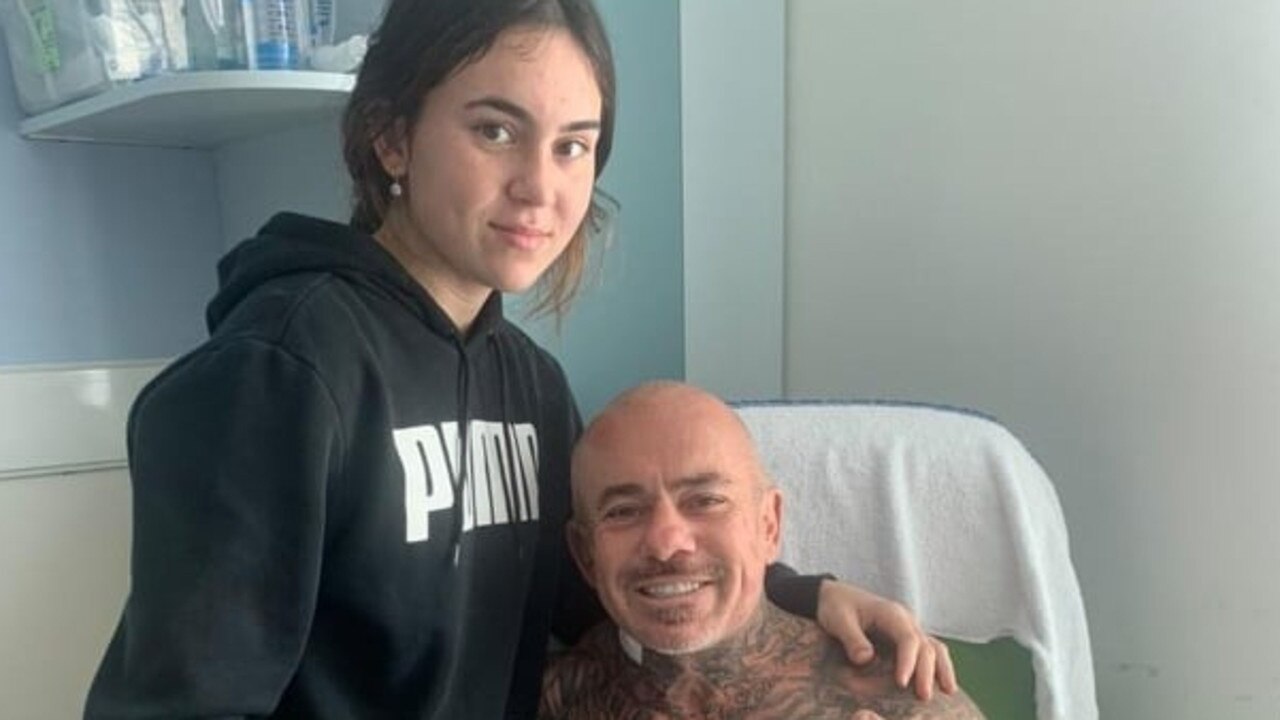 Danny Hawkins with his daughter in the Royal Brisbane and Women’s Hospital.