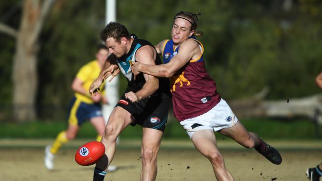 Nathan Winch-Combe (right) of South Morang lays a tackle against St Mary’s on Saturday. Picture: James Ross.