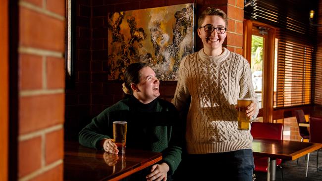 Friends Eleanor Kain and Alex Shutz relish in the chance to share a beer at the Arkaba Hotel. Picture: Morgan Sette