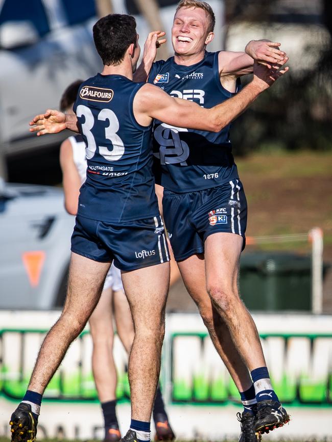 South Adelaide's Ryan Garthwaite celebrates his 60m after-the-siren goal with teammate Ben Shillabeer at Noarlunga Oval on Sunday. Picture: Tom Huntley