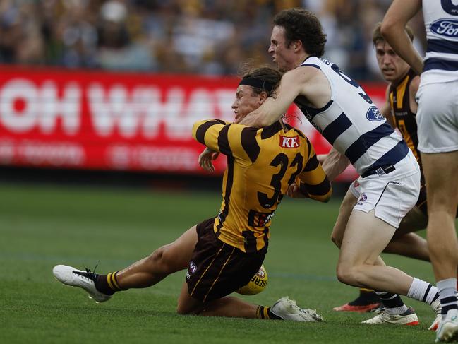 Jack Ginnivan of the Hawks gets taken high but no free kick given. Picture: Michael Klein