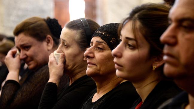 Mourning survivors gathered for a Christian mass in Nineveh province two days after the tragedy. Picture: Zaid AL-OBEIDI / AFP