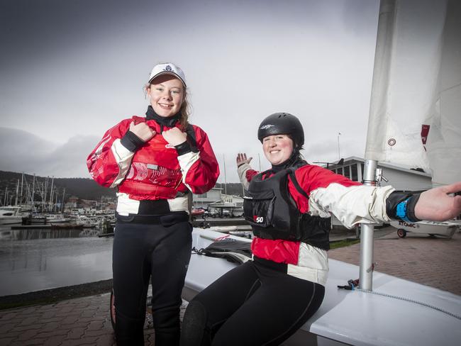 Sailors Nicole Pieterse, 13 and Ellen Hillcoat, 17 loved being out racing on the River Derwent in wet and rainy conditions today. Picture: LUKE BOWDEN