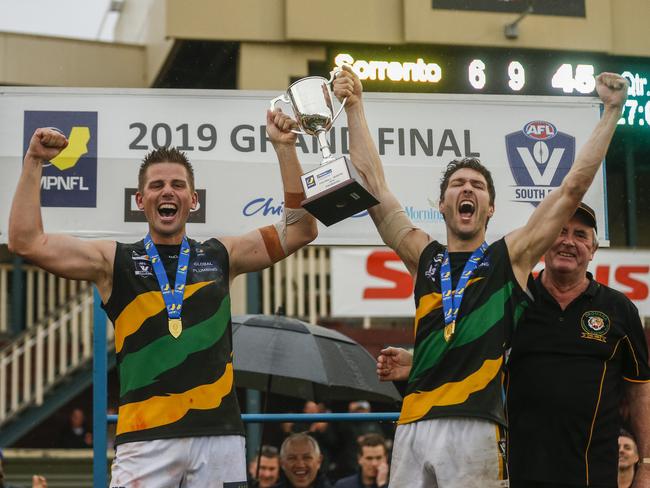 Dromana hoist the 2019 MPNFL Division 1 premiership cup at Frankston Park. Picture: Valeriu Campan