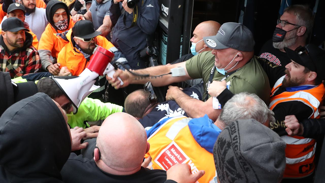Construction workers and other protesters opposed to compulsory Covid-19 vaccinations clash with union bosses. Picture: David Crosling