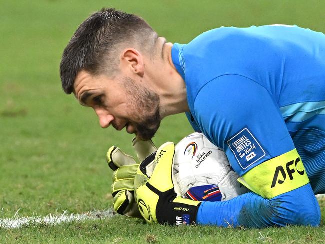 The safe hands of Socceroos skipper and goalkeeper Mat Ryan were evident in Australia’s 5-1 win over Indonesia. Picture: Saeed KHAN / AFP