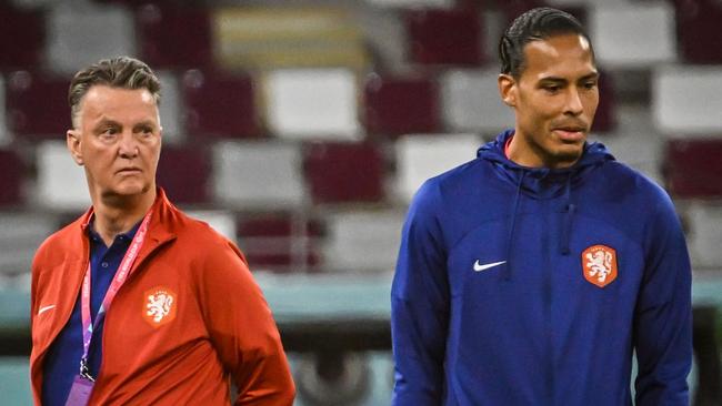 Netherlands' coach Louis Van Gaal (L) and defender Virgil van Dijk (R).