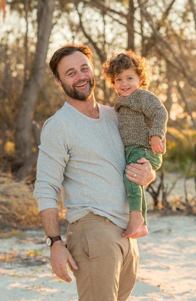 Underbelly star Gyton Grantley, with son Rocco on Flinders Beach, North Stradbroke Island, the place he calls his ‘spiritual home’.