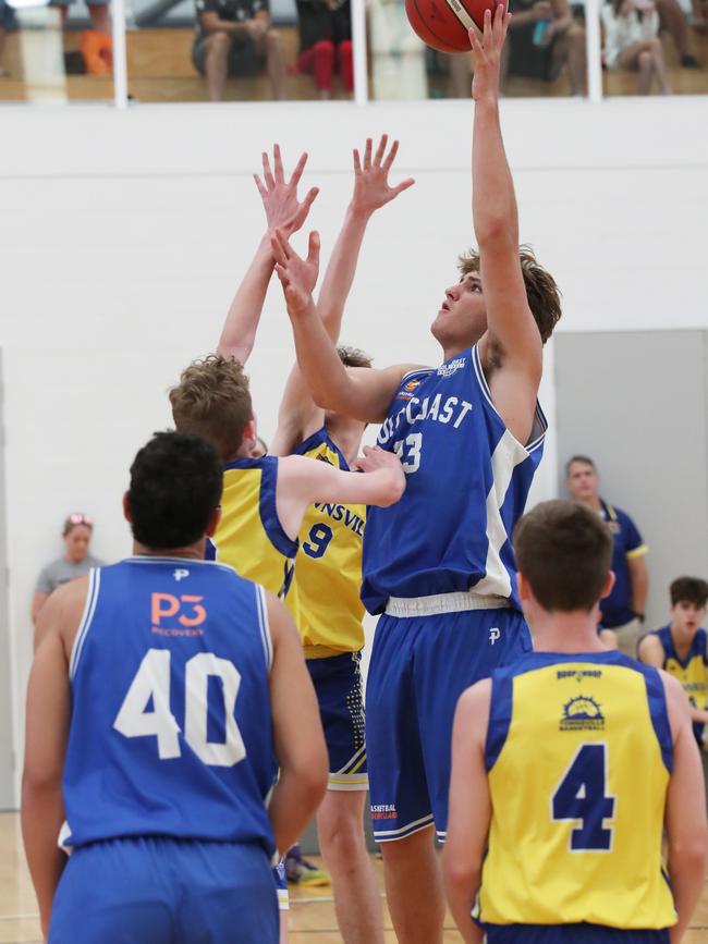 Basketball Queensland Under-16 Boys State Championships at the Coomera Indoor Sports Centre. Gold Coast Rollers (blue) v Townsville Heat Division 1 game . Rollers Nikos Karathanasopoulos (23) and Heats Jack Abbott (8) Picture Glenn Hampson
