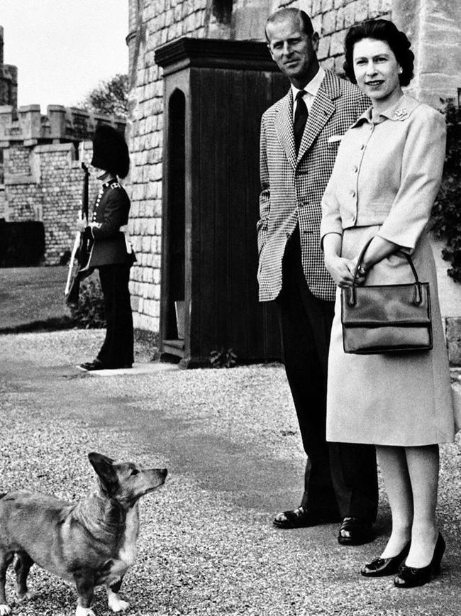 The Queen and Prince Philip with one of their corgis