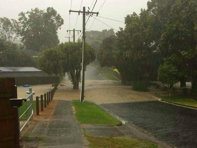 Greenslopes Drive in Mooroolbark became impassable as Brushy Creek burst its banks.