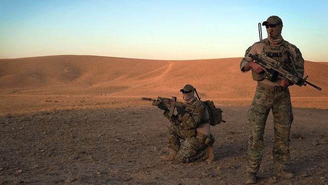 Photo by: Corporal (CPL) Chris Moore    Caption:  Special Operations Task Group (SOTG) soldiers on patrol in Afghanistan.    Middle Caption:   The Special Operations Task Group (SOTG) is deployed to Uruzgan and is focused on conducting population-centric operations, partnered with Afghan forces of the Provincial Response Company (PRC). Picture: Department of Defence