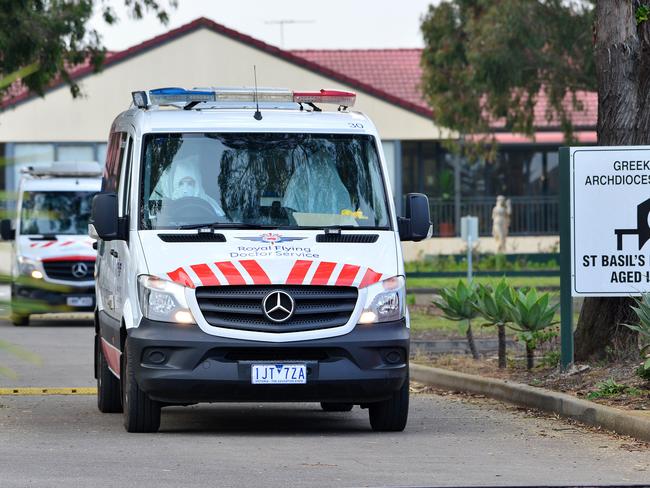 Ill residents are transported from St Basil's Home for the Aged. Picture: Nicki Connolly